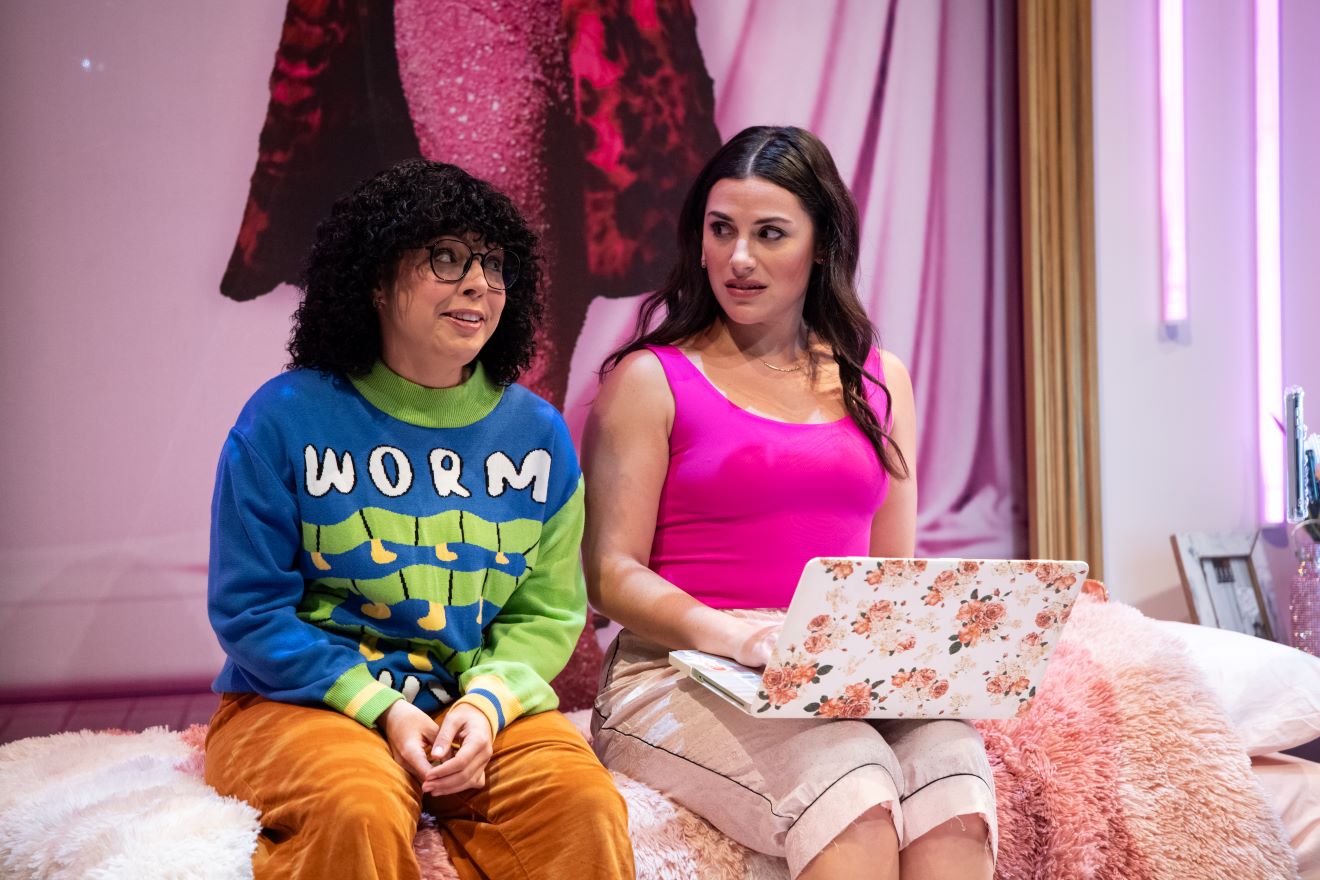 <p>Bekah Zornosa (Barb Kratzyt) and Samantha Sayah (Chava Kanipshin) in <em>A Hanukkah Carol, or GELT TRIP! The Musical</em>. Photo by Margot Schulman.</p>